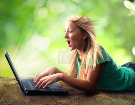 Surprised Teenage Girl with Laptop