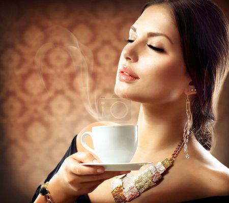Beautiful Woman With Cup of Coffee or Tea