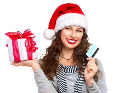 Christmas. Happy Smiling Woman with Gift Box and Credit Card
