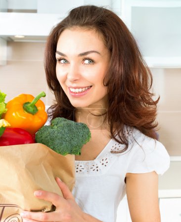 Happy Young Woman with Vegetables in Shopping Bag. Diet Concept 