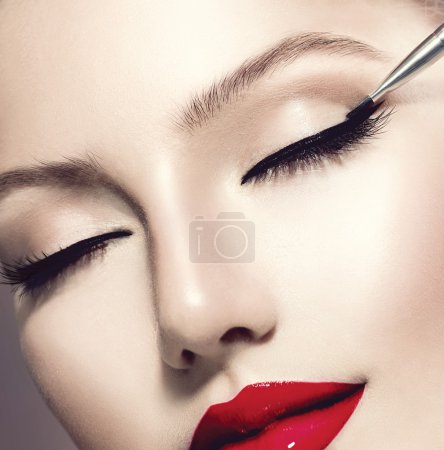 Make-up Applying closeup. Eyeliner