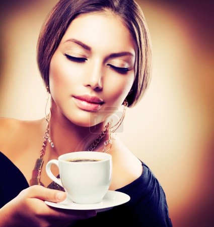 Beautiful Girl Drinking Tea or Coffee. Sepia Toned