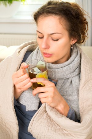 Sick Woman with Hot Drink. Headache. Flu