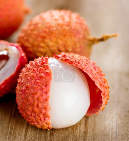 Lychee on a wooden table. Lichi Closeup. Selective focus