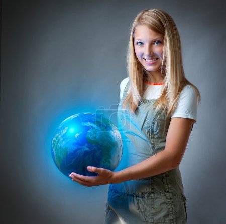 Girl holding the Planet Earth. Future Concept