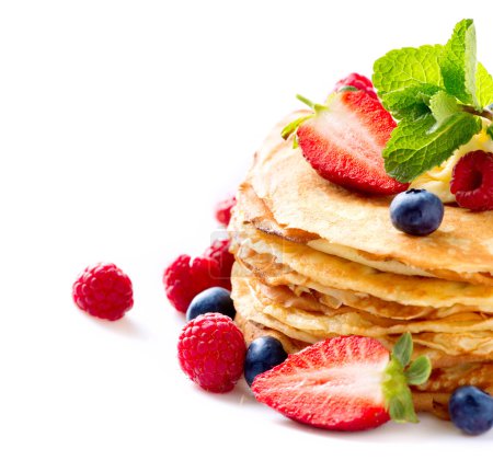Pancake. Crepes With Berries. Pancakes stack isolated on a White
