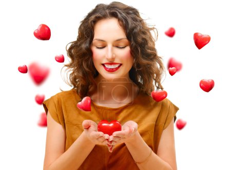 Beauty Young Woman with Valentine Heart in her Hands