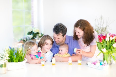 Family with three children enjoying Easter breakfast