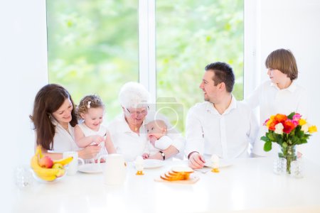 Family with three children having fun together during an Easter breakfast