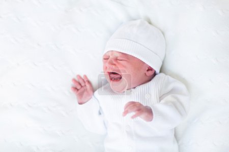 Tiny crying newborn baby