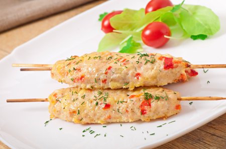 Shish kebab of chicken with peppers and cheese