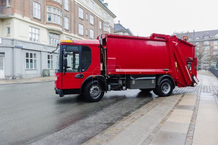 Red garbage disposal truck