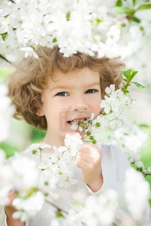 Happy child with spring flower