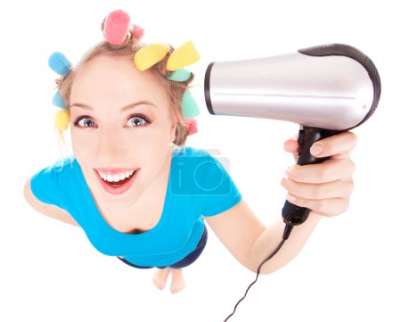 Funny girl styling hair, holding hairdryer