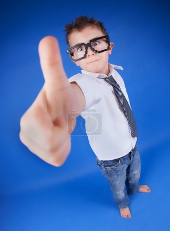 Six years old boy with thumb up