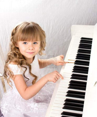 little girl and piano