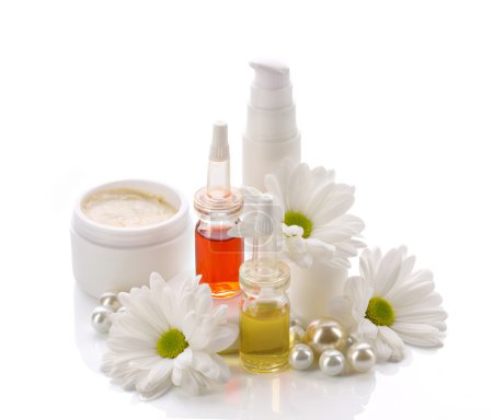 natural cosmetics products with pearls and flowers