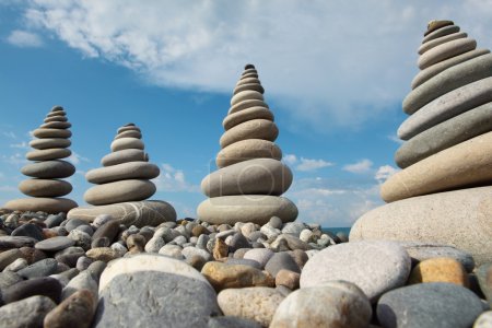 Stone stacks against sky