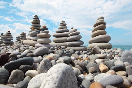 Zen stones against sky