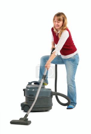 Housewife with vacuum cleaner