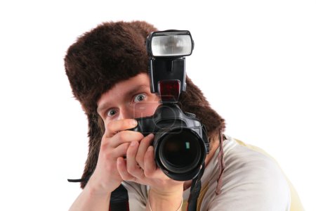 Photographer in a cap with ear-flaps