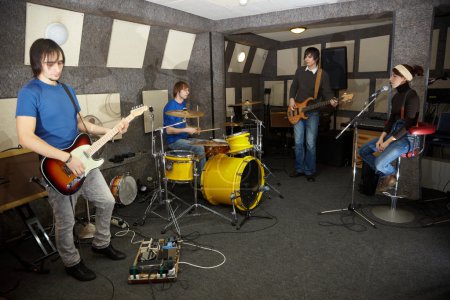 Rock band is working in studio