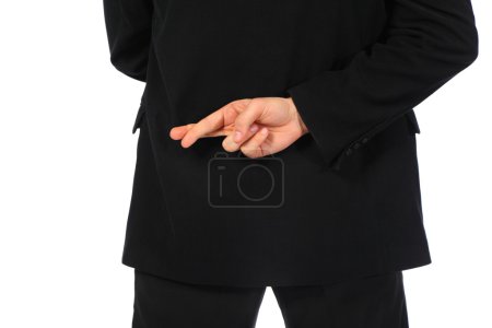 Businessman with fingers crossed behind his back