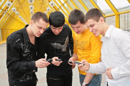 Group of young men with cell phones