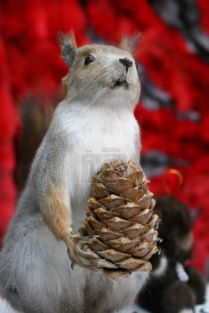 Scarecrow of squirrel with cone