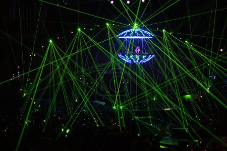 DJ in laser beams