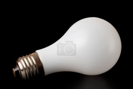 White mat lamp with metal socket on black background
