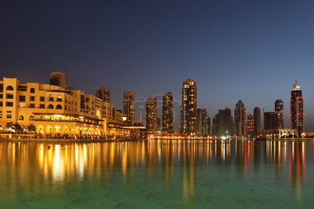 Dubai skyscrapers and other buildings at night time, view from w