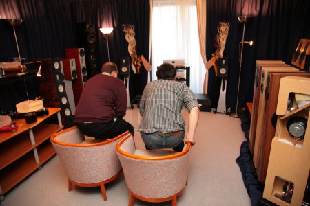 Two men in room with hi-end audio system