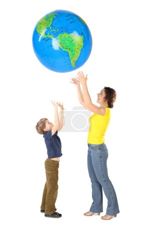 Mother and son throw up big inflatable globe, side view, isolate