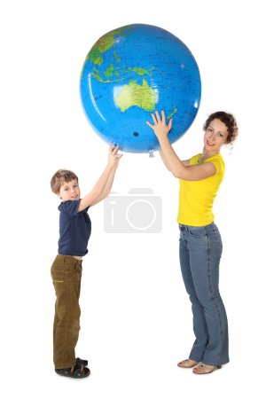 Mother and son holding big inflatable globe and looking at camer