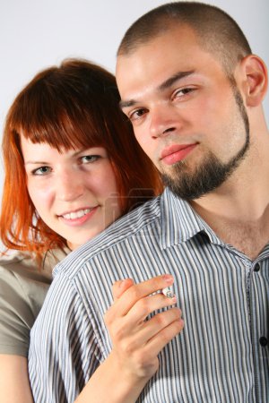 Young man and red hair woman