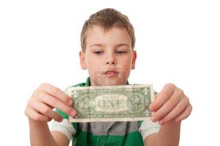 Boy holds one dollar in both hands isolated on white background