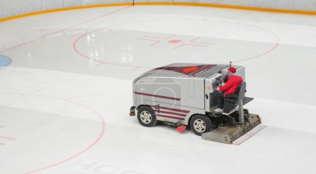Hockey stadium with machine for resurfacing ice