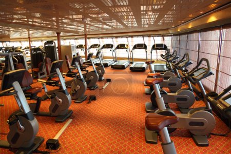 Large gym hall with treadmills and exercise bicycle in cruise sh