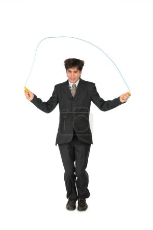 Businessman, who jumps through jumping rope