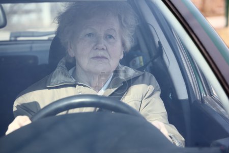 Elderly woman in car