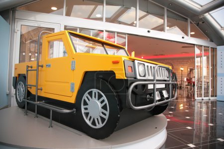 Model of off-road vehicle at entrance into shopping center
