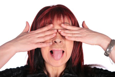 Woman close eyes and showing tongue