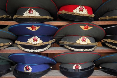 Ussr polisman uniform hats with visor on wooden shelf