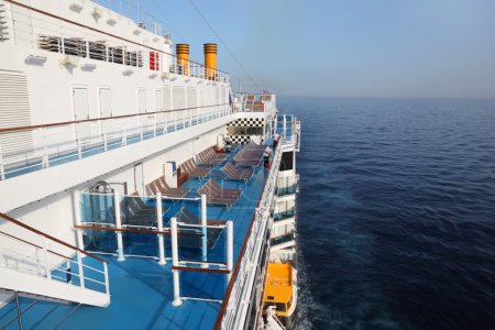 Cruise ship deck with blue floor in ocean view from above