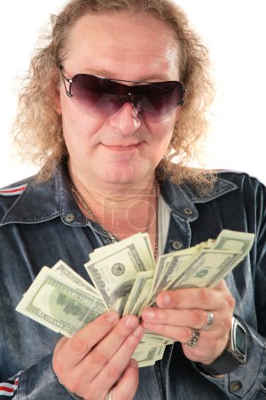 Man in sunglasses with dollars