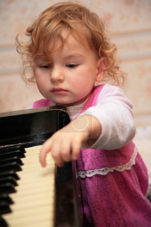 Little girl and piano