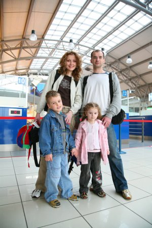 Standing traveling family of four