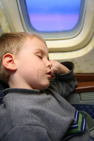 Boy airplane sleep