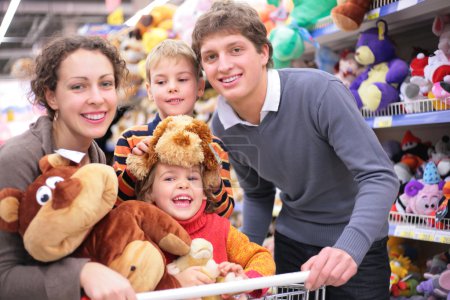 Family in shop with soft toys